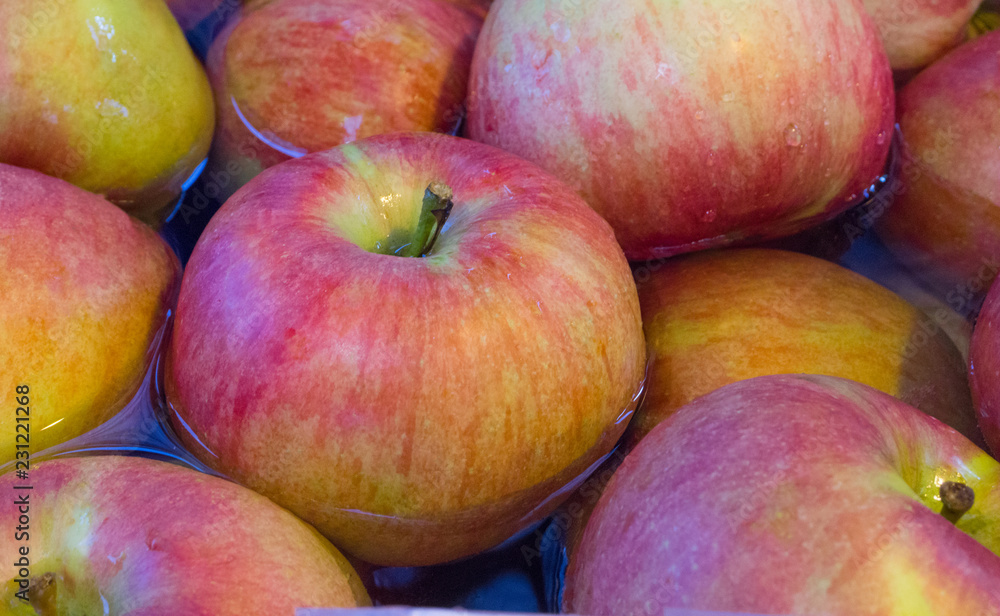 Red apples organic fruit wash by water in bowl,delicious food,beautiful background Red apples organic fruit wash by water in bowl,delicious food,beautiful background
