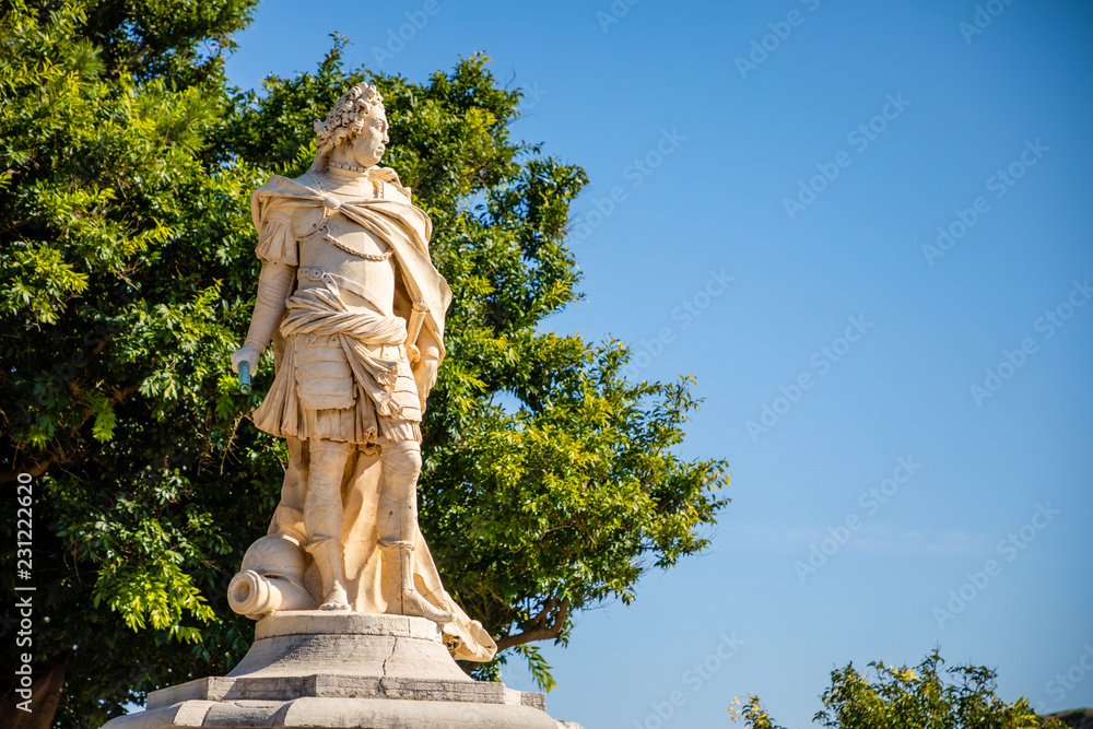 Statue next to Old Venetian fortress and Hellenic temple at Corfu, Ionian Islands in Greece
