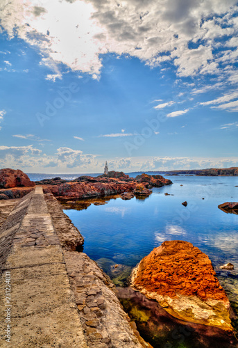 Beautiful landscape with lighthouse and blue sea