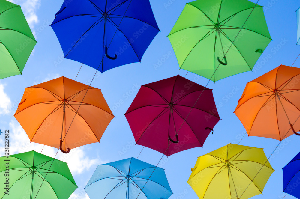 many bright umbrellas against the sky many bright umbrellas against the sky