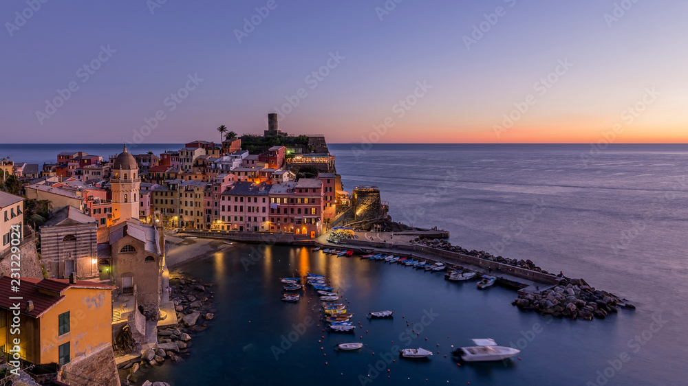 Colorful aerial view of the historic center of Vernazza after sunset, Cinque Terre park, Liguria, Italy