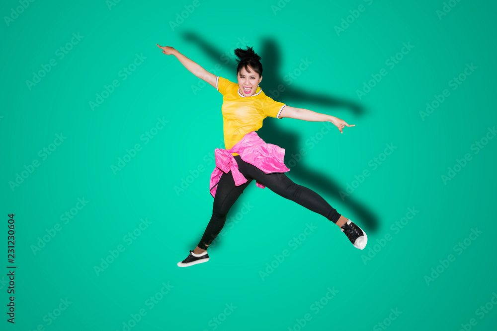 Attractive female modern dancer jumping