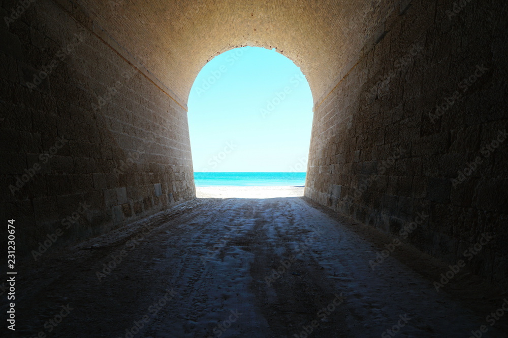 Inside a tunnel that leads to the sea shore, natural scene, l'Aliga beach, Mediterranean, Catalonia, Costa Dorada, L'Ametlla de Mar, Tarragona, Spain