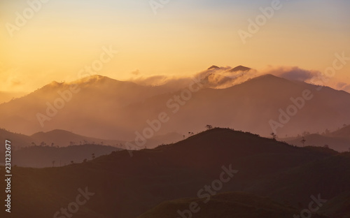 Beautiful mountain with cloud and sunrise at Tong Pa Phum national park  Thailand. Landscape of the misty mountain covered on a hilltop at rural Thailand.