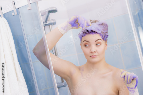 Woman applying toner shampoo on her hair