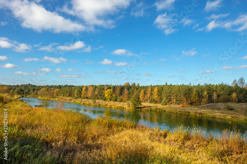 Autumn landscape with bright blue sky and river