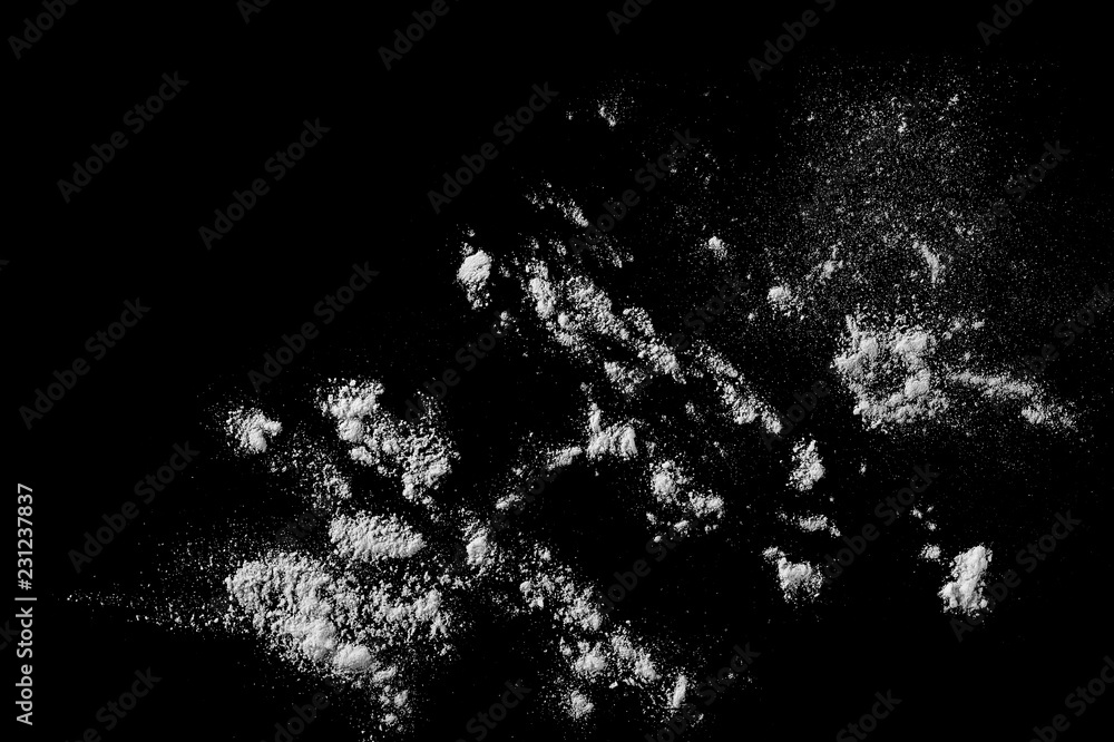 Pile of wheat flour isolated on black background, powder texture, top view with clipping path