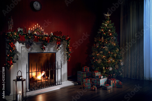 view of nice white christmas decorated fireplace and christmas tree