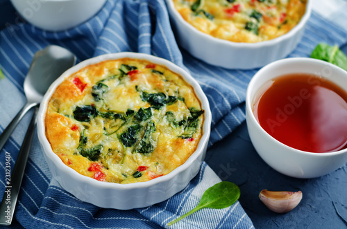 Spinach Red Bell Pepper Baked Omelet with cups of tea and fresh spinach leaves