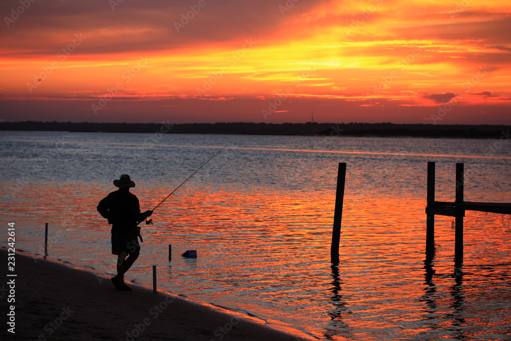 Fisherman awaiting his catch, Topsail Island, NC