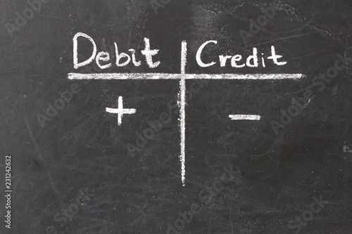 Double-entry bookkeeping, debit and credit on chalkboard © Jenny
