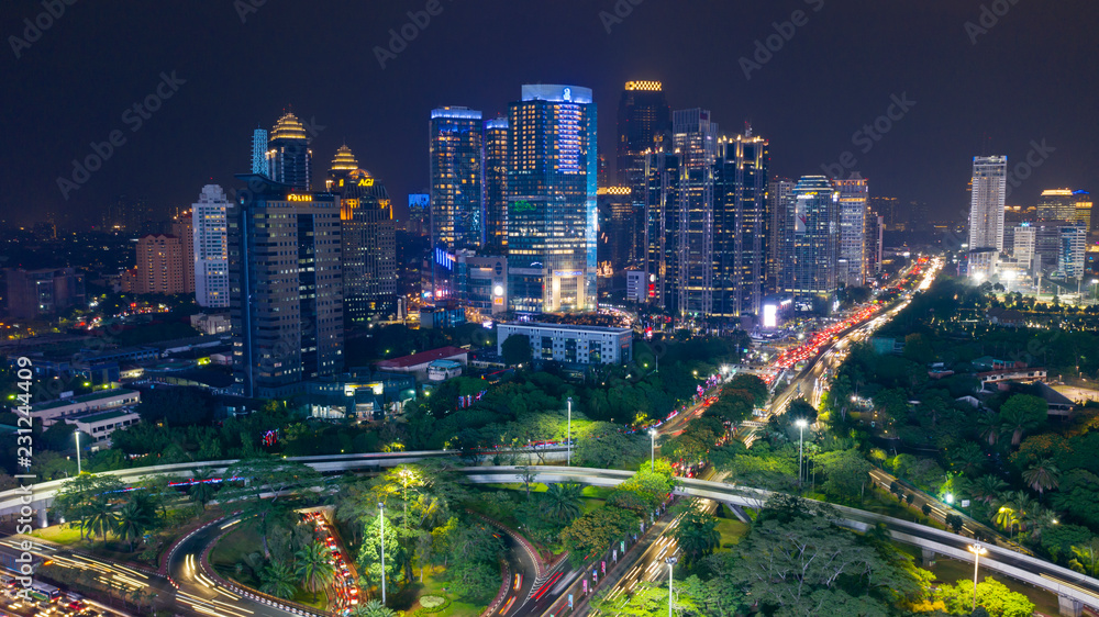 Naklejka premium Semanggi bridge with skyscrapers at night