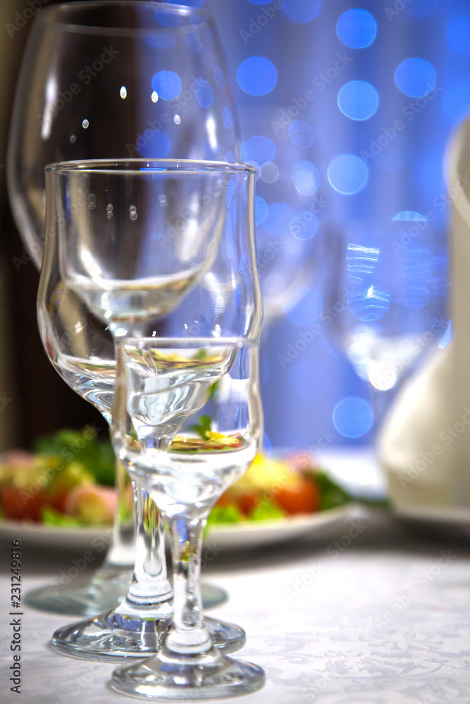 Empty glasses of wine and water on the holiday table Empty glasses of wine and water on the holiday table