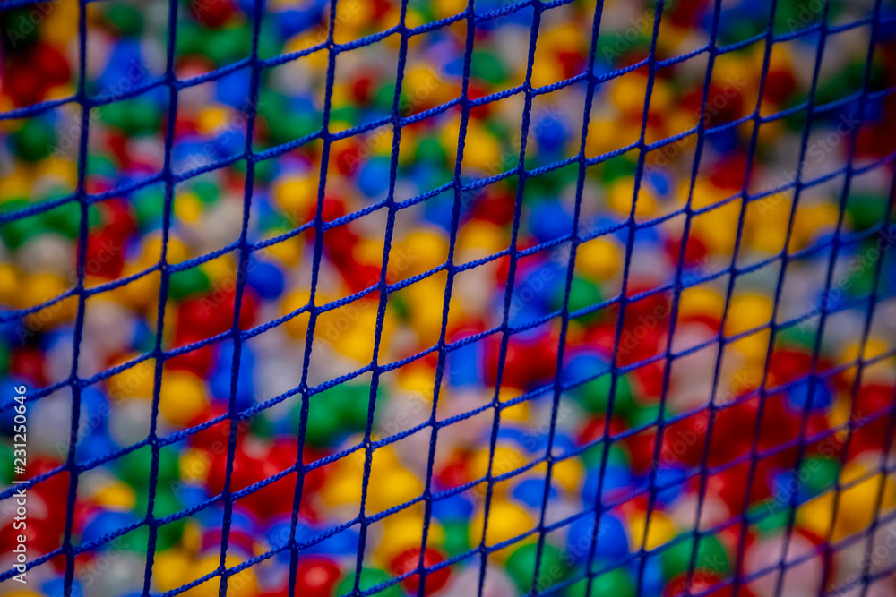 grid on the blurred background of colored balls grid on the blurred background of colored balls