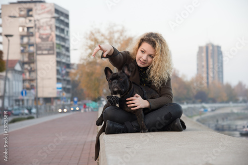 Teenager girl with the dog near the river