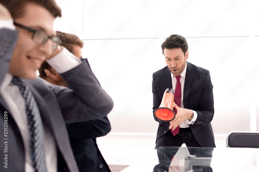 Manager yells at colleagues during a business meeting. Manager yells at colleagues during a business meeting.