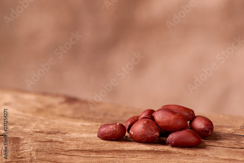 peanut hill Deep fried peanuts over rustic wicker background. emptiness place. Space for text. copyspace