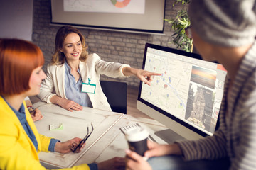 Woman at work with female group in agency