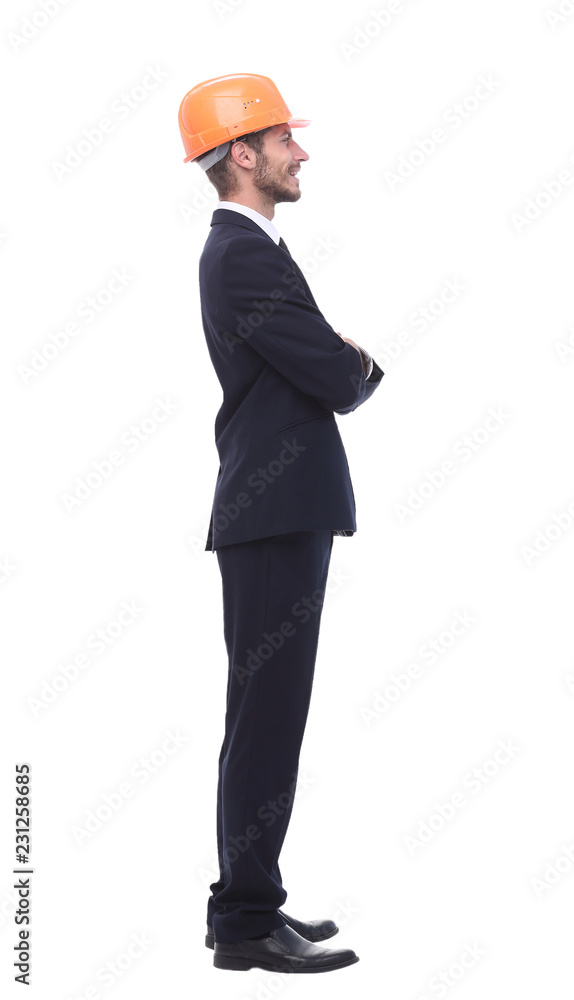 in full growth. a serious businessman in a protective helmet in full growth. a serious businessman in a protective helmet