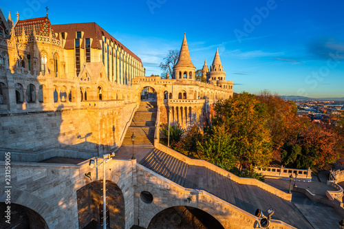 Budapest, Hungary - Golden sunrise at the Fisherman's Bastion with Matthias Church and clear blue sky at autumn