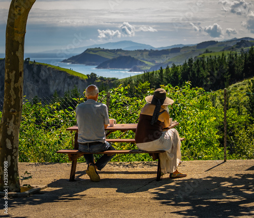senior couple sitting outside