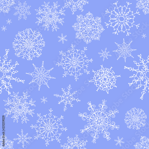 Seamless pattern of hand drawn doodle style snowflakes isolated on blue background. Vector illustration.