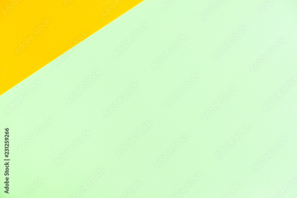 Pastel colored paper flat lay top view, background texture, orange and green. Pastel colored paper flat lay top view, background texture, orange and green.