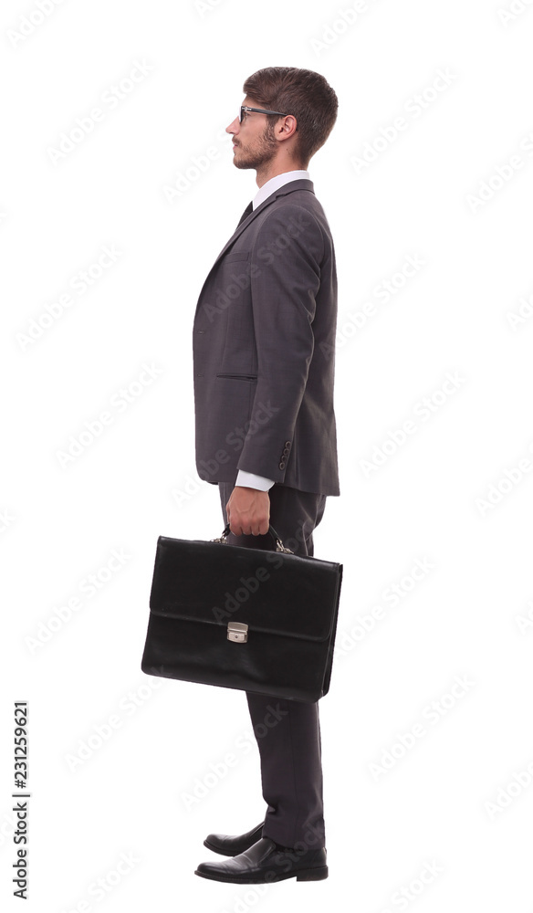 side view. confident businessman with leather briefcase side view. confident businessman with leather briefcase