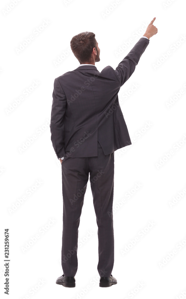 rear view. young businessman pointing to copy space rear view. young businessman pointing to copy space