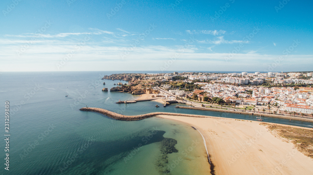 Aerial view of beautiful Meia Praia beach in Lagos, Algarve, Portugal at morning