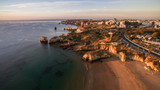 Aerial view of beautiful cliffs and beach near Lagos, Algarve, Portugal at sunrise