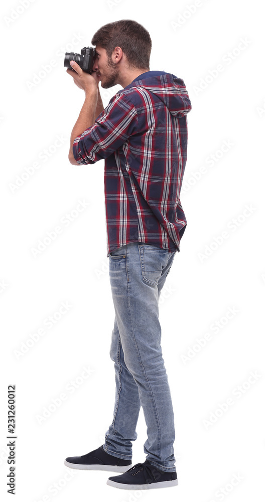side view . attentive young man with a camera. side view . attentive young man with a camera.
