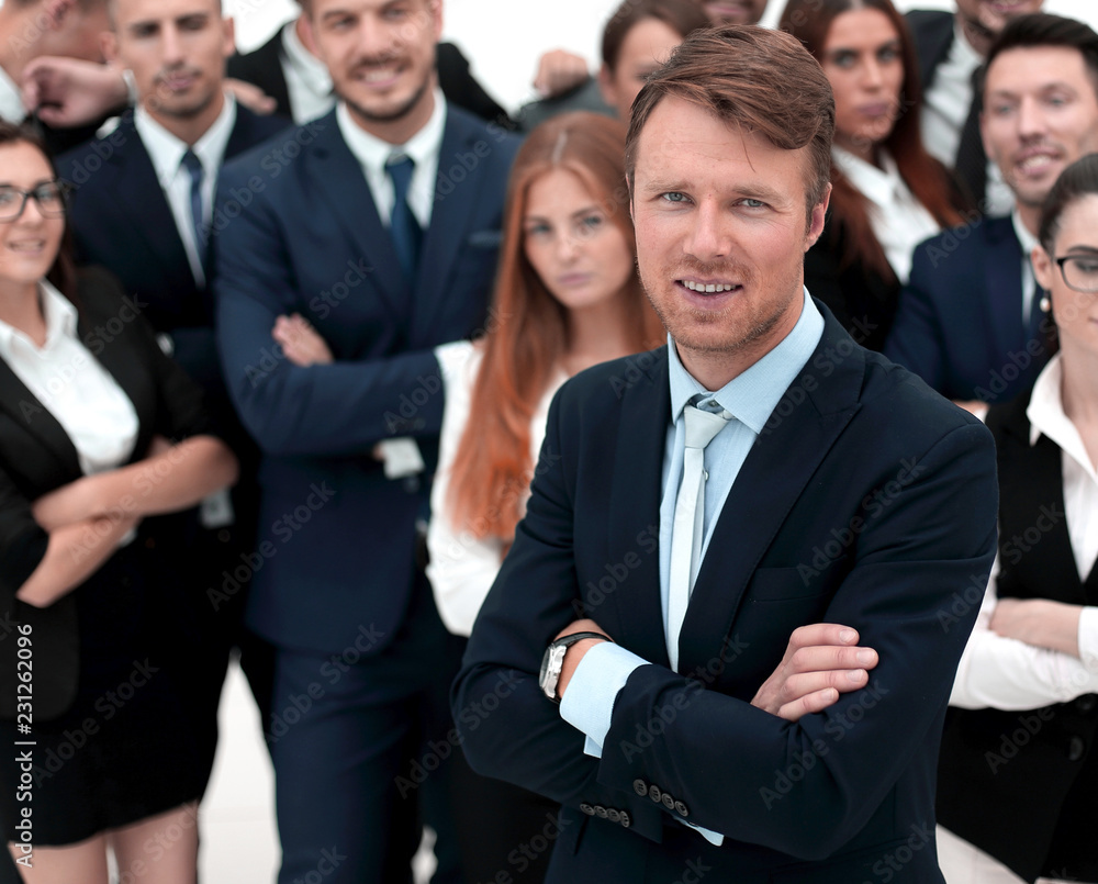 happy businessman standing on background of her business team. happy businessman standing on background of her business team.