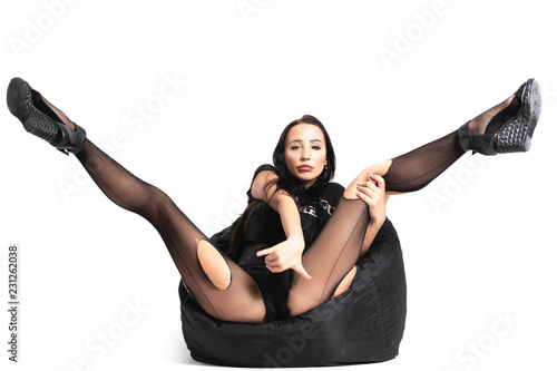 pantyhose or torn black nylon tights on legs of woman isolated on white background, black friday