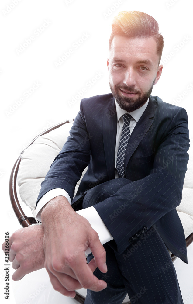 successful businessman sitting in a chair. successful businessman sitting in a chair.