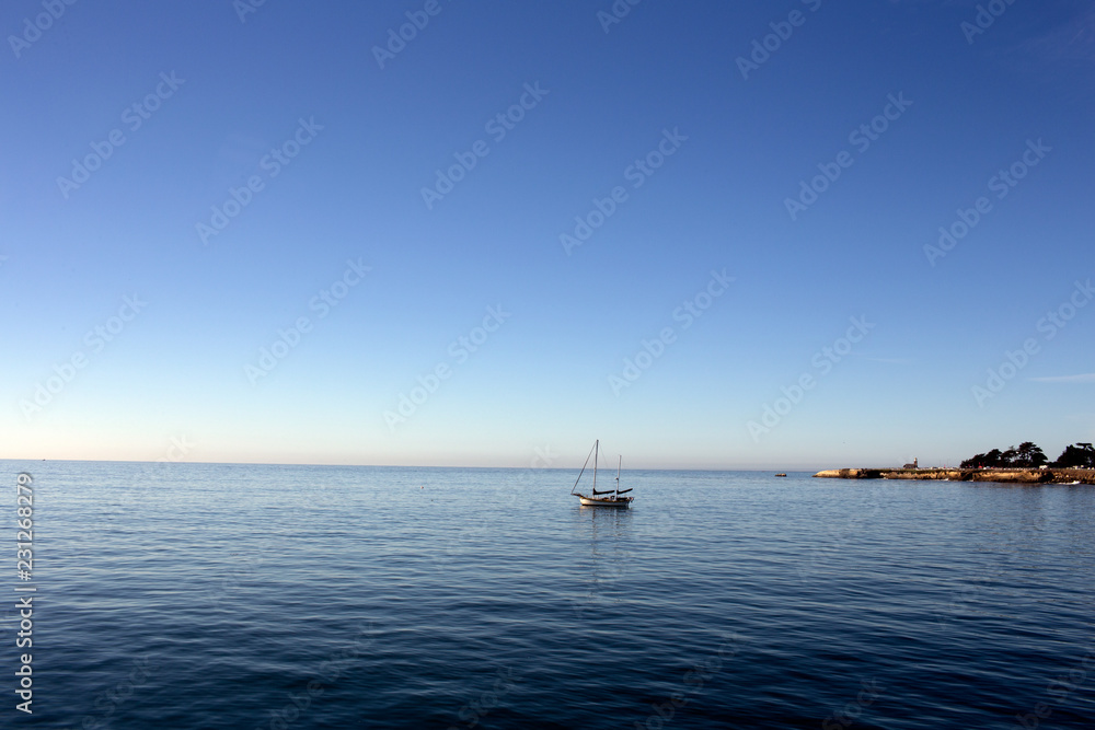 Sailboat at mooring in harbor