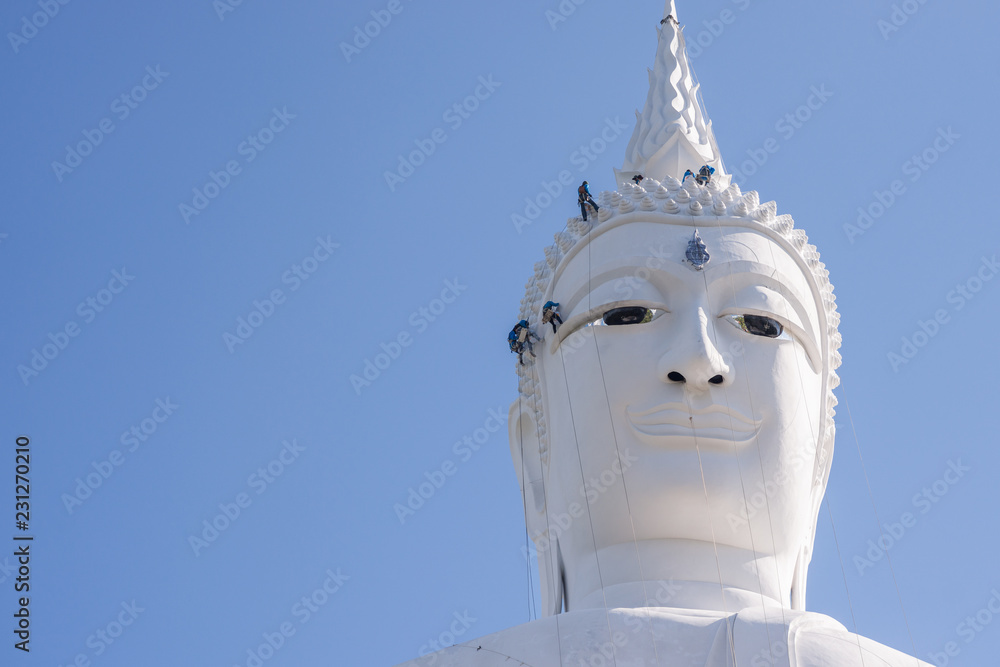 Engineer is being repair building head statue monk in Thailand temple,Wat PHUMANOROM Mukdahan-Thailand