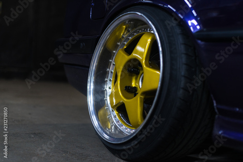 Legendary alloy two-piece sport rims on beautiful wheels in polished and gold color