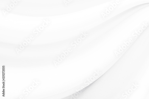 White silk or satin luxury cloth texture background. white wave background 