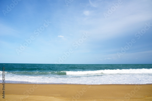 White Sea wave and blue ocean with sandy beach Background in Summer holidays Time of Happiness