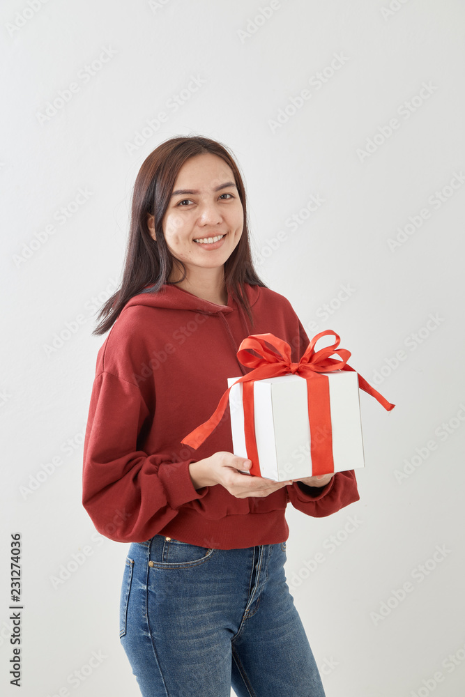 Young woman happy hold gift box in hands Young woman happy hold gift box in hands