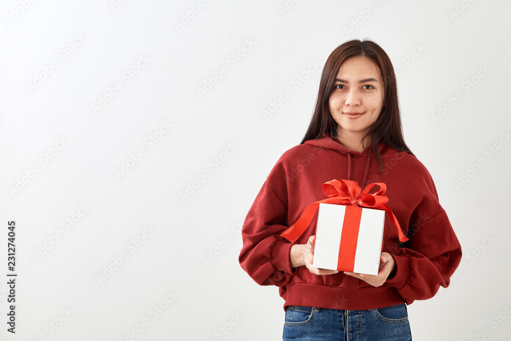 Young woman happy hold gift box in hands Young woman happy hold gift box in hands