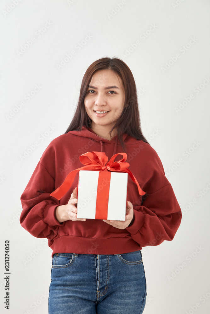 Young woman happy hold gift box in hands Young woman happy hold gift box in hands