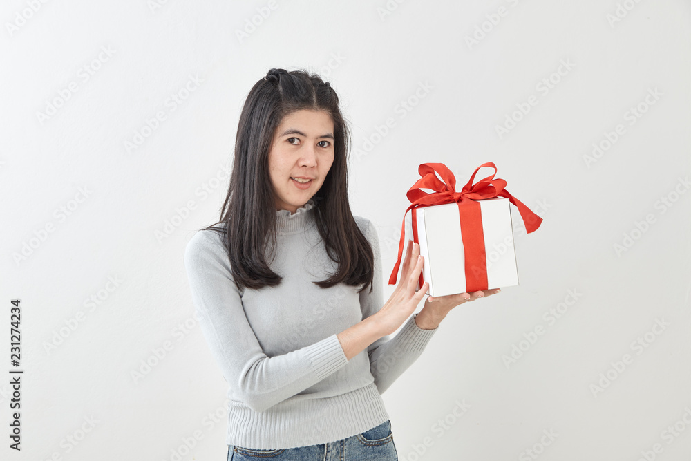 Young woman happy hold gift box in hands Young woman happy hold gift box in hands