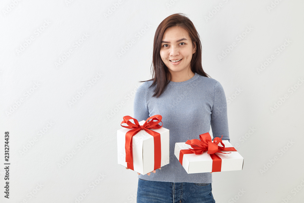 Young woman happy hold gift box in hands Young woman happy hold gift box in hands