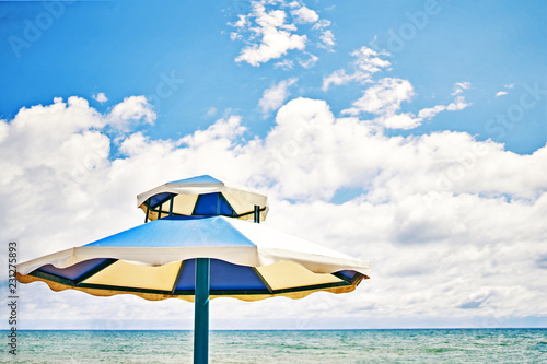 Beach umbrella on sunny day.