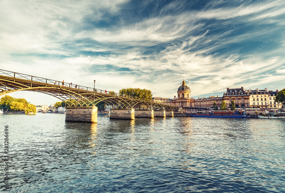View on the Arts bridge in Paris, France, on a summer day. Travel background.