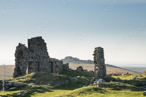 Canvas Print Stunning landscape sunset image over abandoned Foggintor Quarry in Dartmoor with