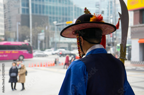 Photography The gatekeepers standing at the entrance of Deoksugung Palace in Seoul, South Ko