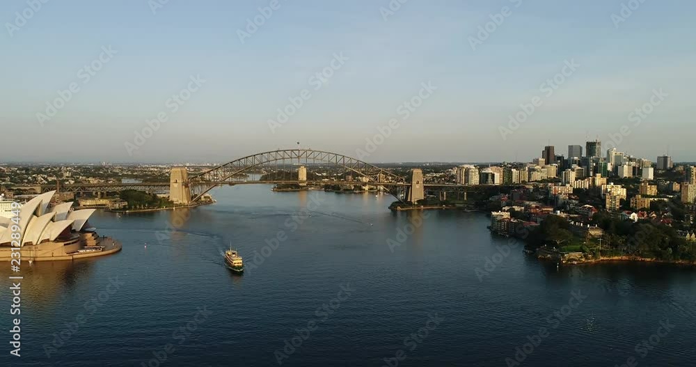 Rotation up in the air over waters of Sydney harbour observing wide panorama of city suburbs on both shores of the harbour connected by the Harbour Bridge.
Rotation up in the air over waters of Sydney harbour observing wide panorama of city suburbs on both shores of the harbour connected by the Harbour Bridge.